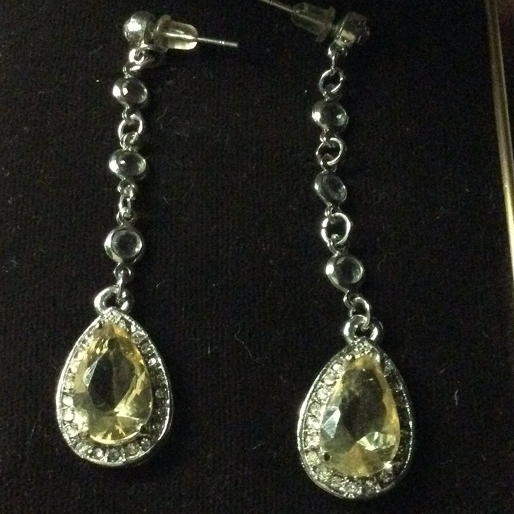 Long silver crystal dangling earrings with pale yellow stone